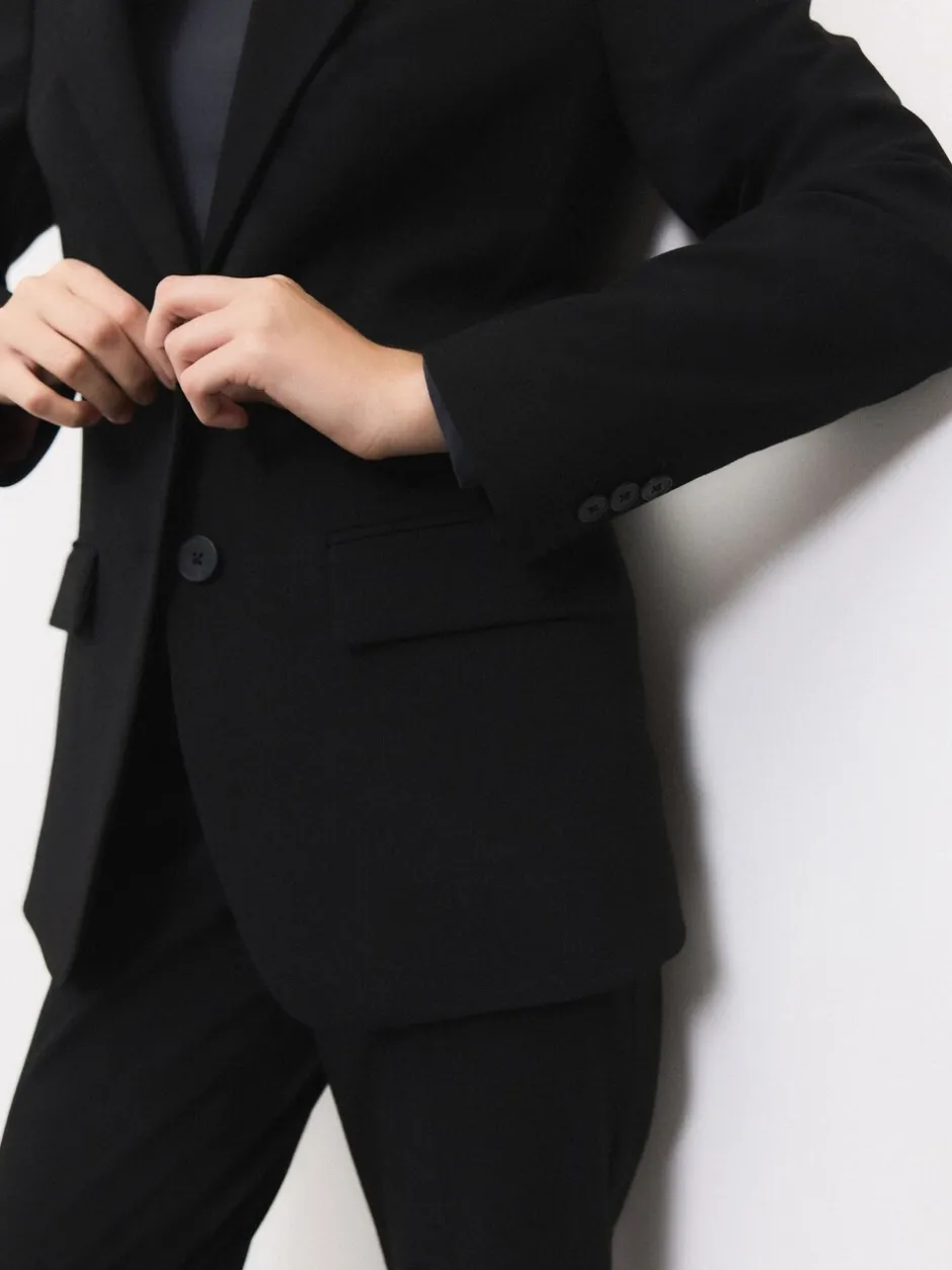 Kostuums En Werkkleding*Next - Op maat gemaakte blazer met enkele rij knopen van wol Zwart