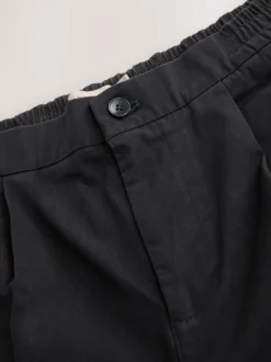 Broeken En Chino's*Next - Standaard toelopende pasvorm - Pleated Stretch Chinos Trousers With Elasticated Waist Zwart