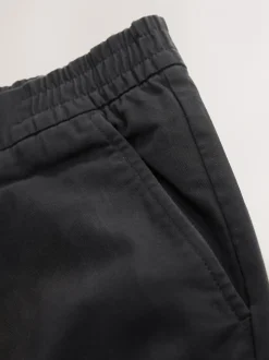 Broeken En Chino's*Next - Standaard toelopende pasvorm - Pleated Stretch Chinos Trousers With Elasticated Waist Zwart