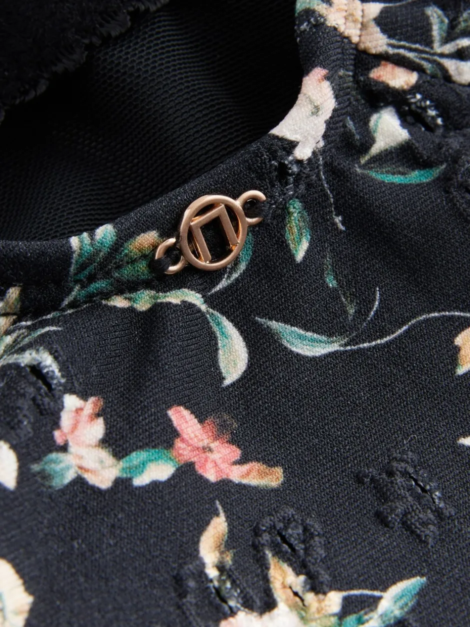 Badkleding|Next Zwart met broderie en fijne print - Badpak met vormgevende zijrimpeling en buikcorrectie
