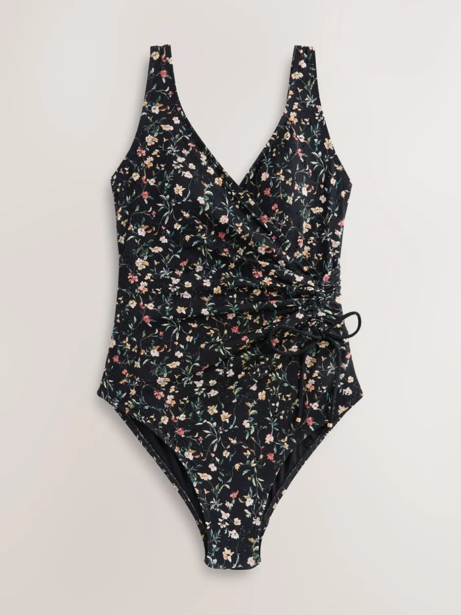 Badkleding|Next Zwart met broderie en fijne print - Badpak met vormgevende zijrimpeling en buikcorrectie