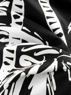 Badkleding*Next Zwart/Crème Palm - Vormgevend bandeaubadpak met buikcorrectie en afgeronde pijpen