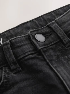 Jeans*Next Zwarte wassing - Stretchjeans (3-17jr)