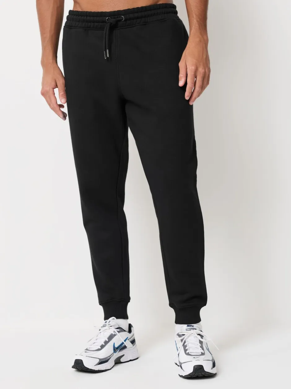 Joggingbroeken|Next - Verpakking van 3 slim-fit jersey joggingbroeken met hoog katoengehalte Zwart/marineblauw/grijs