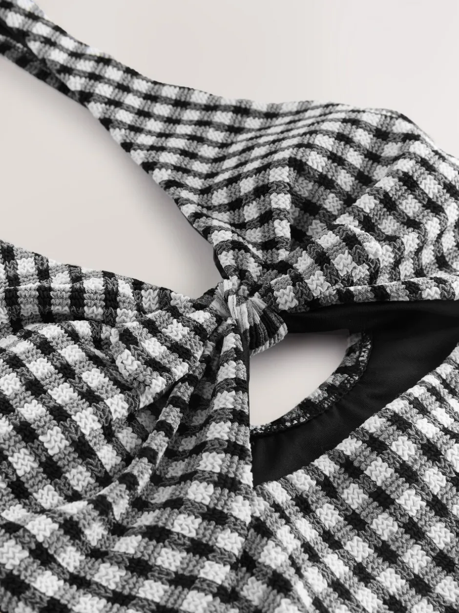 Badkleding*Next Zwart/wit gekreukte gingham-ruit - Uitgesneden plooi buik controle Zwempak