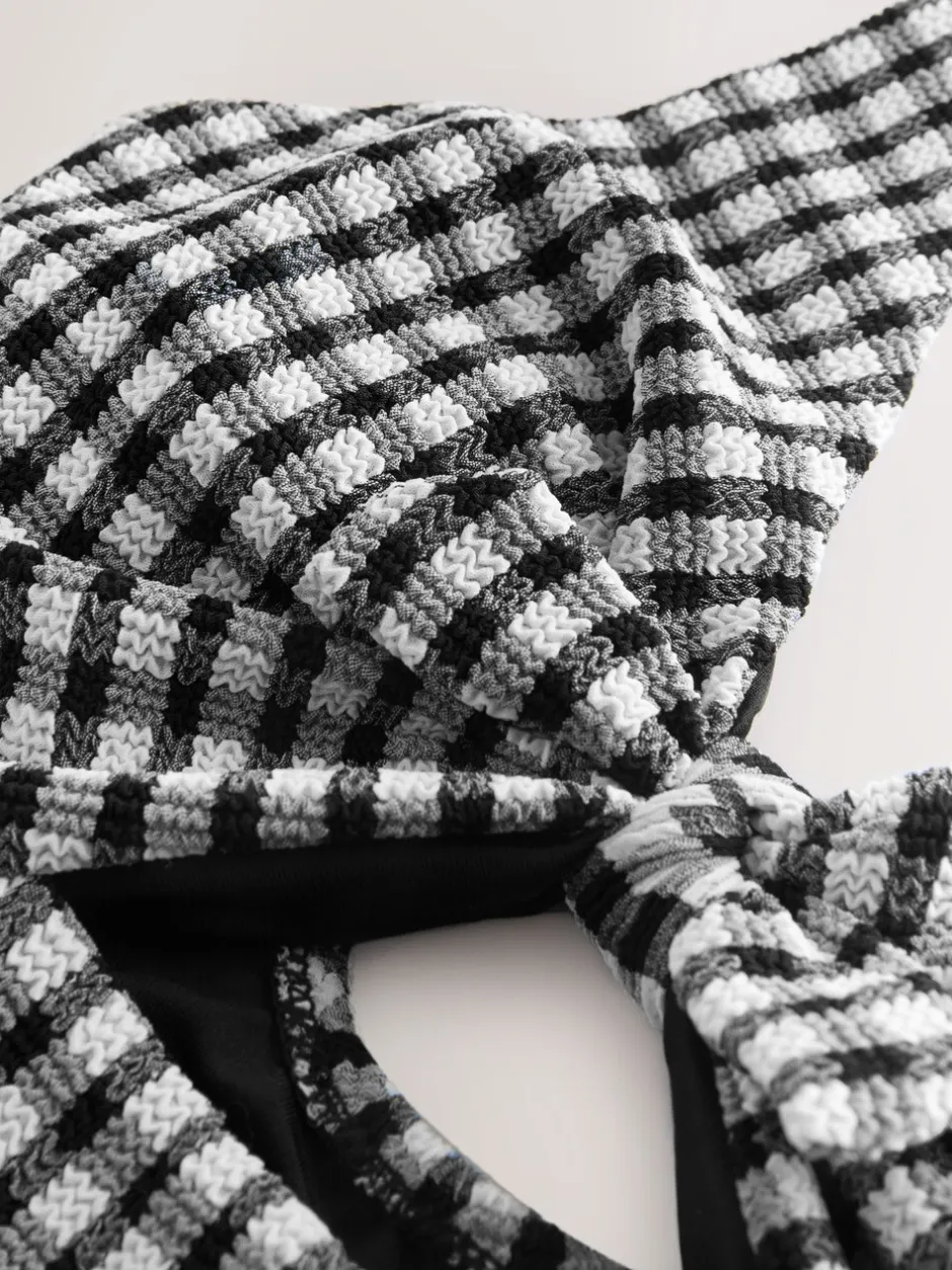 Badkleding*Next Zwart/wit gekreukte gingham-ruit - Uitgesneden plooi buik controle Zwempak