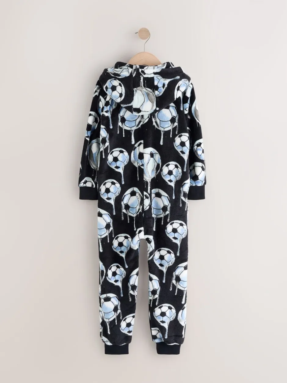 Nachtkleding En Pyjama's|Pyjama's|Next - All-in-ones fleece pyjama (3-16jr) Zwart/wit met voetbal