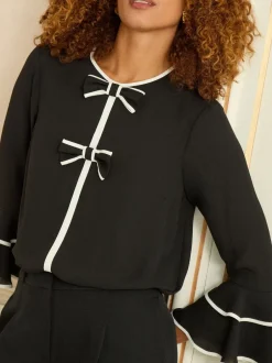 Blouses En Overhemden*Love & Roses - Crew Neck Pleated Flute Sleeve Blouse Zwart-witte strik